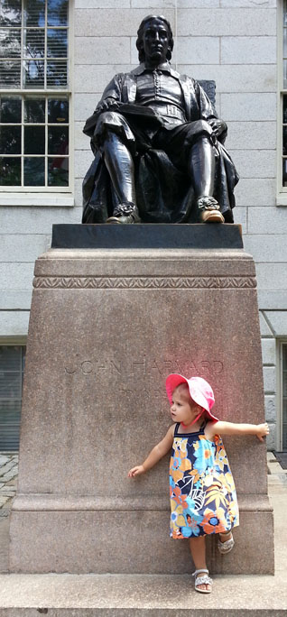 Darwin posing in front of the statue of John Harvard